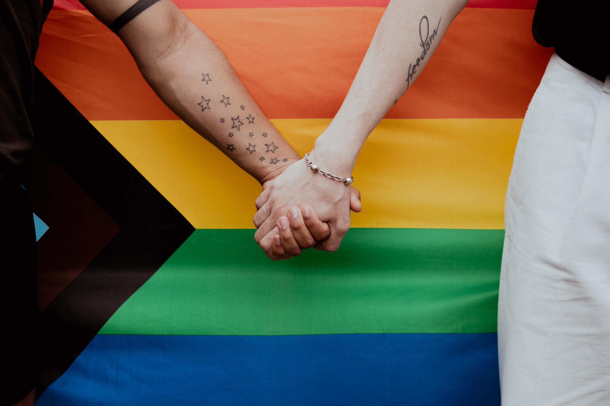 LGBTQ couple holding hands